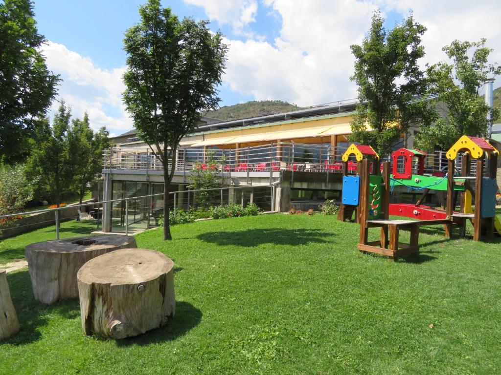 a playground in front of a building at Alberg la Bruna in Bellver de Cerdanya 