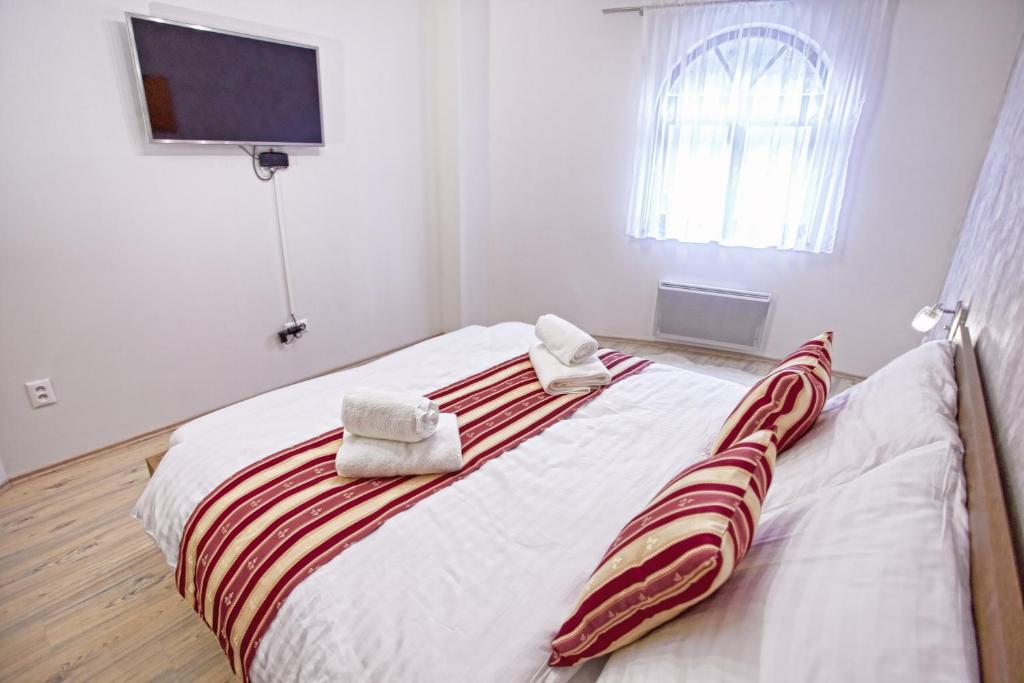 Postel nebo postele na pokoji v ubytování Apartmán ENZO č 103 Tále Chopok Juh