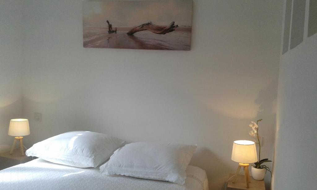 Postel nebo postele na pokoji v ubytování Blanc d'ecume