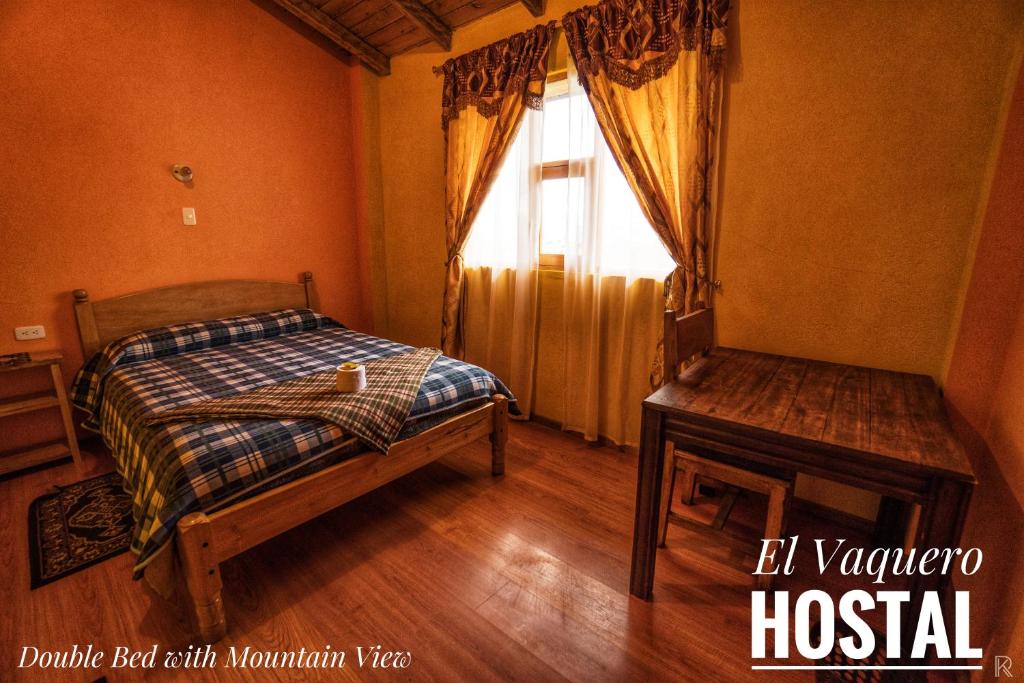 Postel nebo postele na pokoji v ubytování Hostal el Vaquero