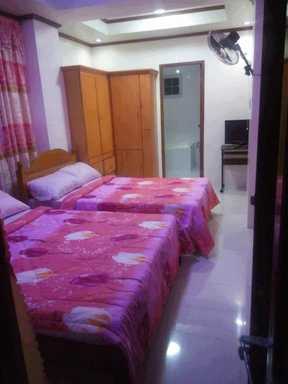 Postel nebo postele na pokoji v ubytování Mary Chiang Baguio Transient House