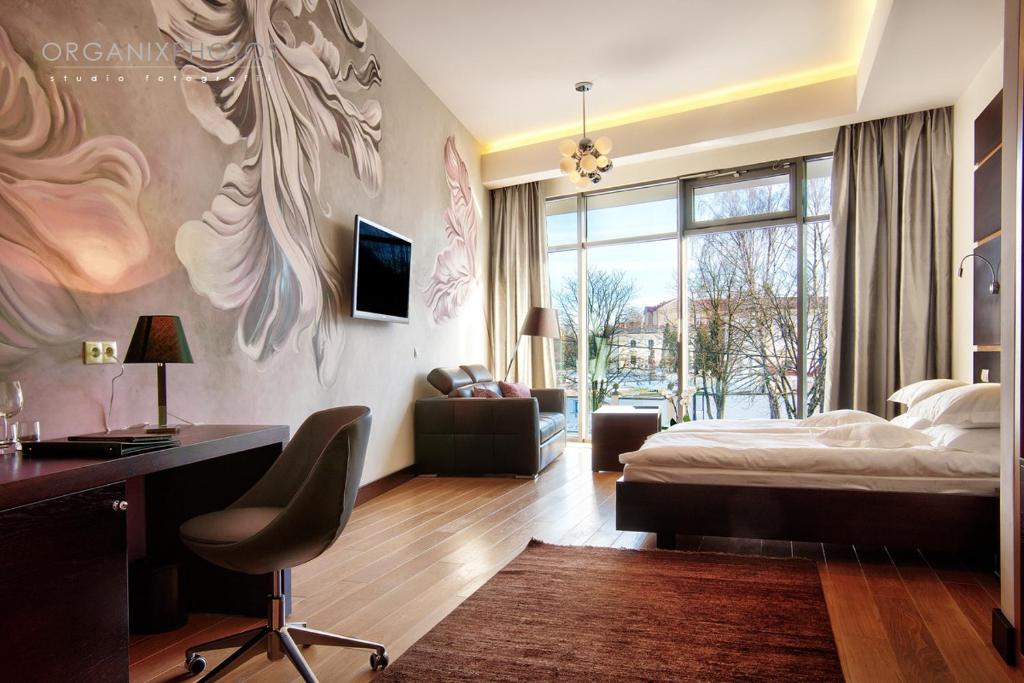 Posteľ alebo postele v izbe v ubytovaní BoutiqueHotel Aristo