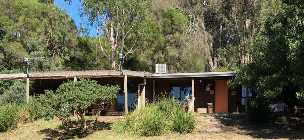 a small house in the middle of a forest at Country Lane Lysterfield in Rowville