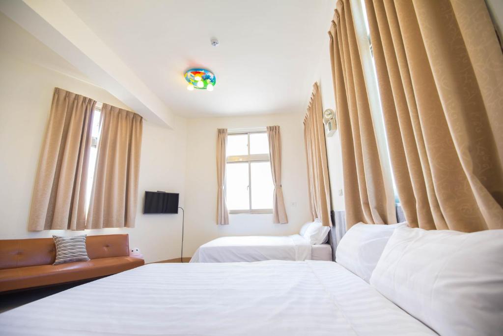 Postel nebo postele na pokoji v ubytování Happiness B&B