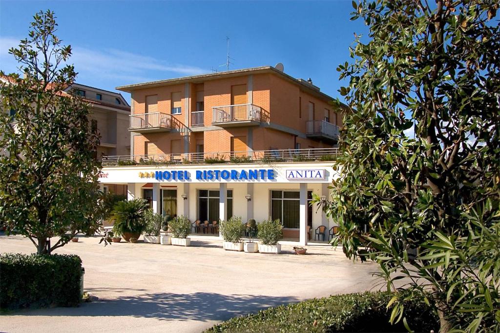 a building with a sign on the front of it at Hotel Ristorante Anita in Cupra Marittima
