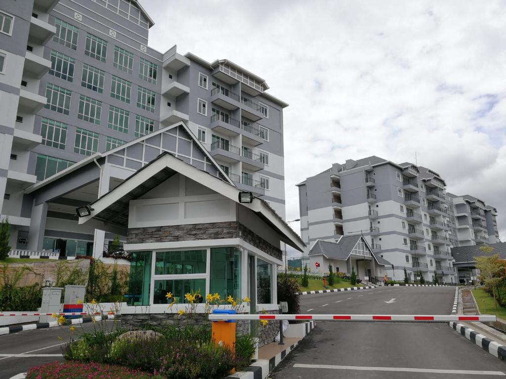 a building in the middle of a street with tall buildings at Omni Cassia Hill Resort in Cameron Highlands