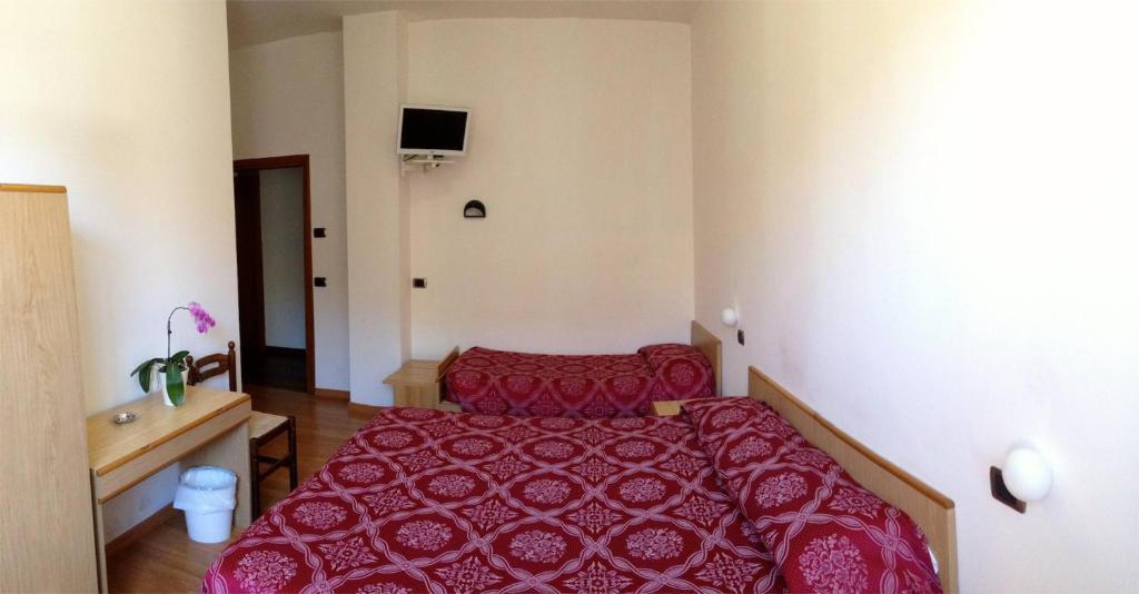 Posteľ alebo postele v izbe v ubytovaní Hotel Ristorante Anita