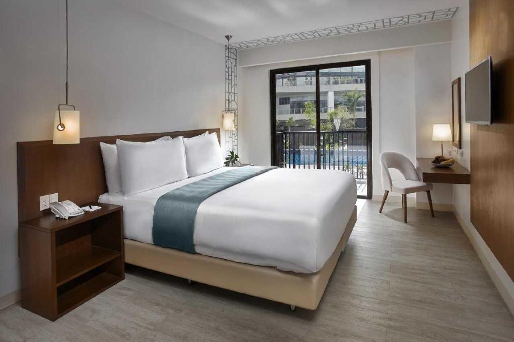 Postel nebo postele na pokoji v ubytování Quest Hotel Tagaytay