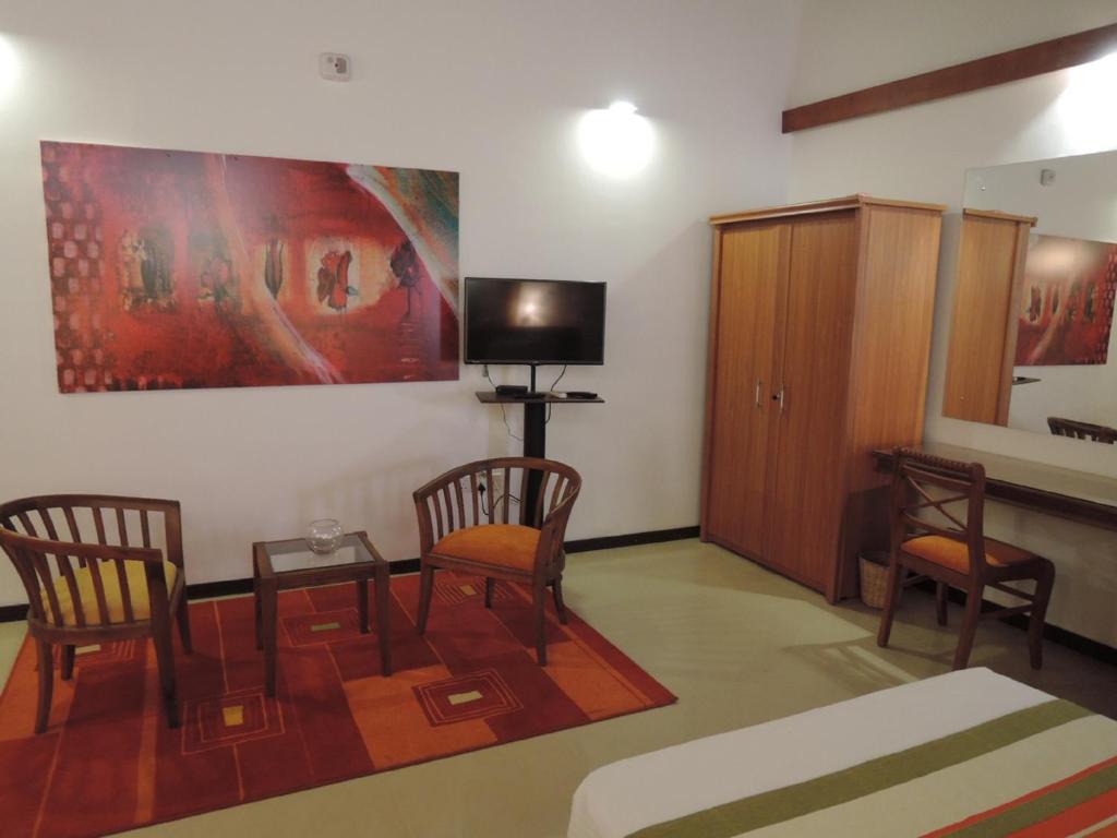 TV a/nebo společenská místnost v ubytování Anugaa in The City