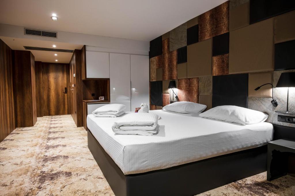 Postel nebo postele na pokoji v ubytování Hollywood Hotel