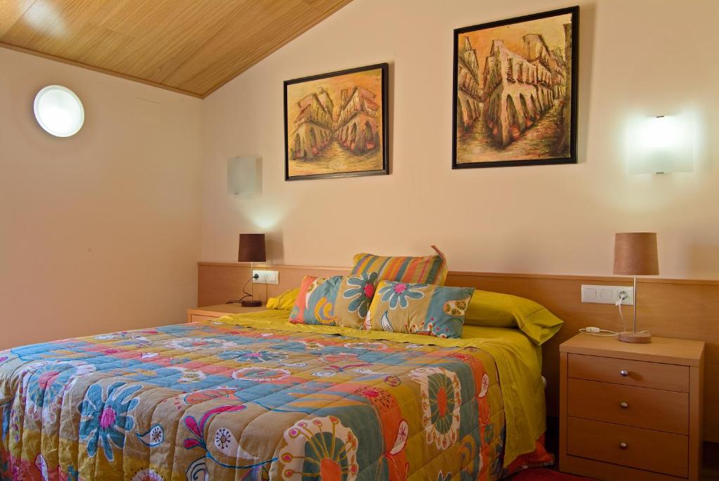 Llit o llits en una habitació de Hotel Pinxo