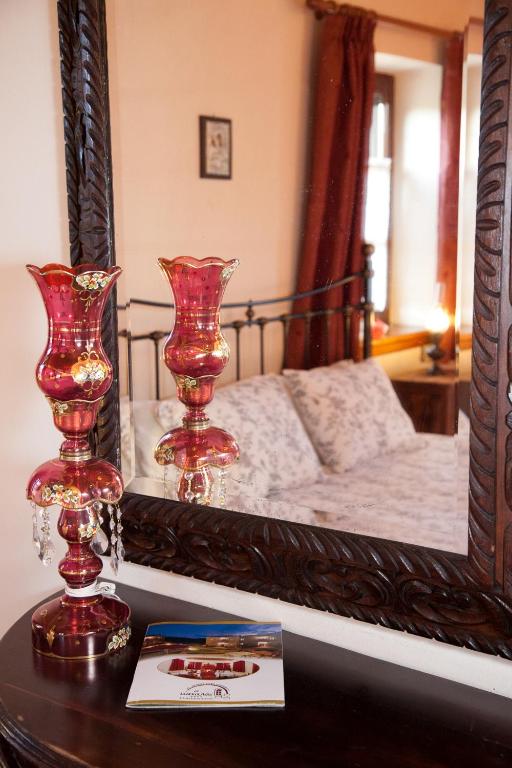 Postel nebo postele na pokoji v ubytování Hotel Machalas
