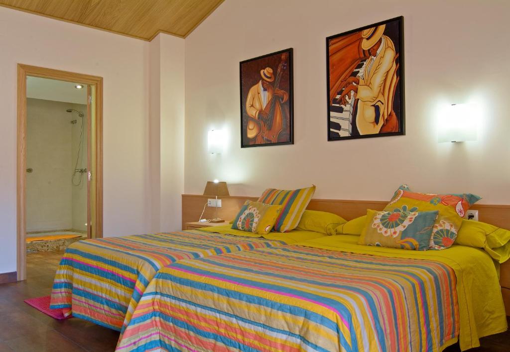 Postel nebo postele na pokoji v ubytování Hotel Pinxo