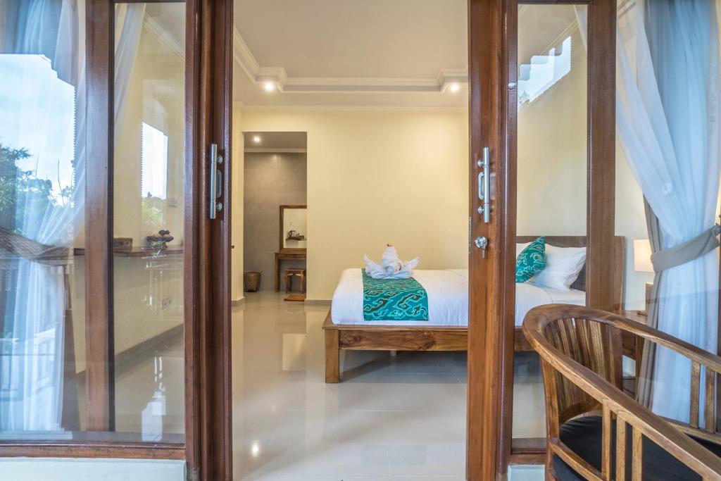 Letto o letti in una camera di Darba Guest House Ubud