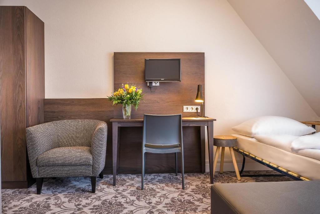Postel nebo postele na pokoji v ubytování Signature Hotel Astoria