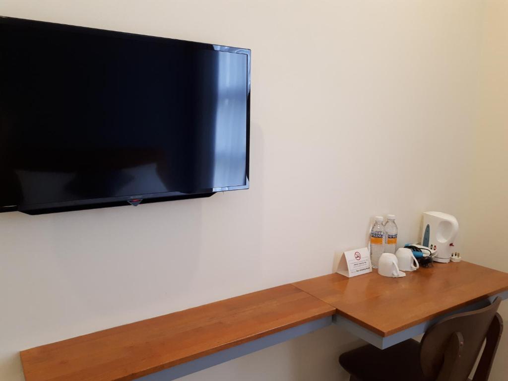 TV a/nebo společenská místnost v ubytování Hotin Inn