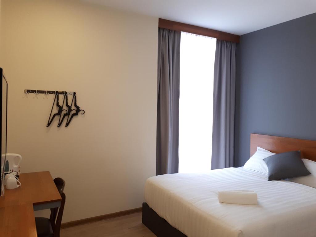 Postel nebo postele na pokoji v ubytování Hotin Inn
