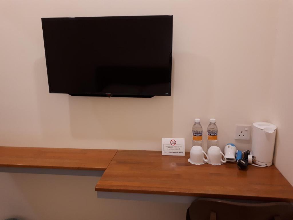 TV a/nebo společenská místnost v ubytování Hotin Inn