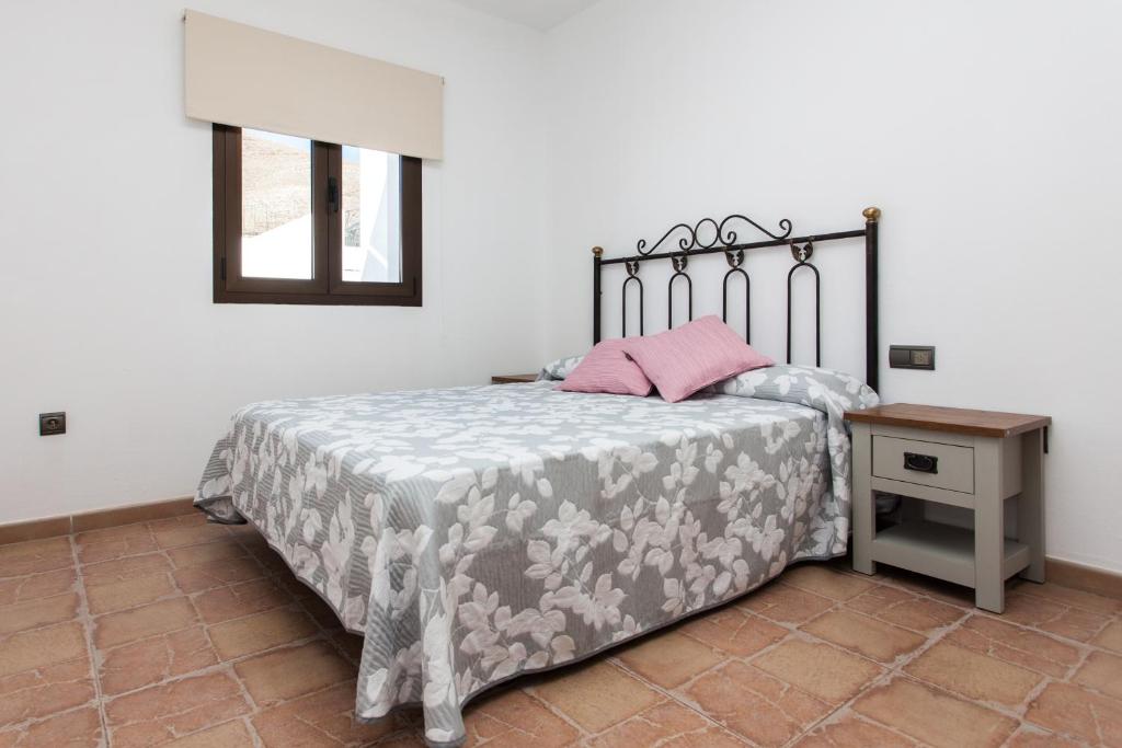 Postel nebo postele na pokoji v ubytování Casa el Aceitunal
