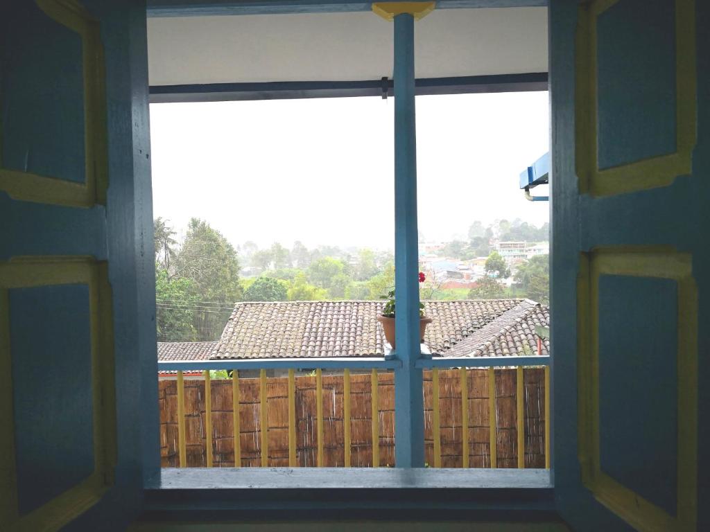 an open window with a view of a roof at Hotel Salento 1842 in Salento