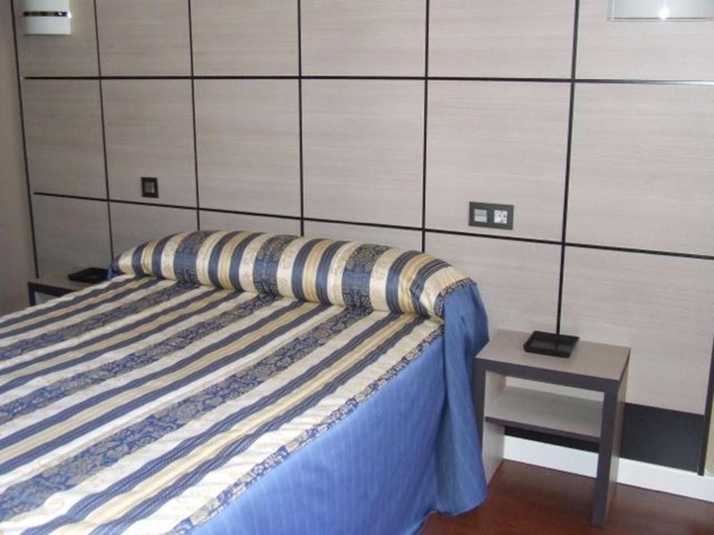 Posteľ alebo postele v izbe v ubytovaní Hostal Larios