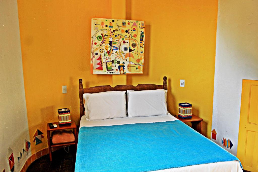 Postel nebo postele na pokoji v ubytování Art Hotel Aos Sinos Dos Anjos