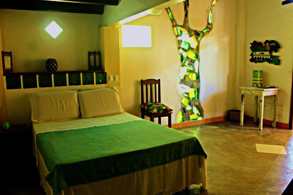 Postel nebo postele na pokoji v ubytování Art Hotel Aos Sinos Dos Anjos