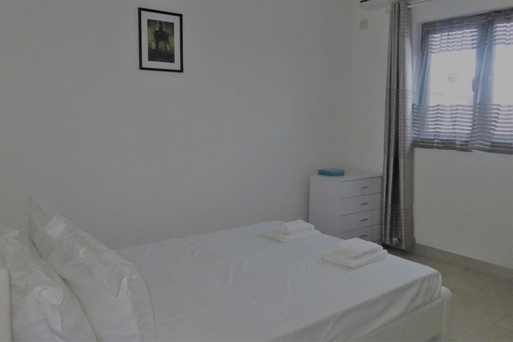 Postel nebo postele na pokoji v ubytování Ibiz Tourist Residence 2