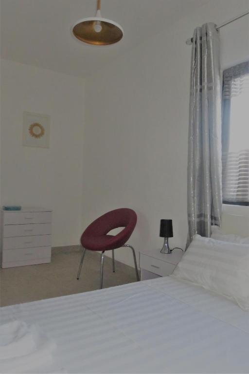 Postel nebo postele na pokoji v ubytování Ibiz Tourist Residence 2