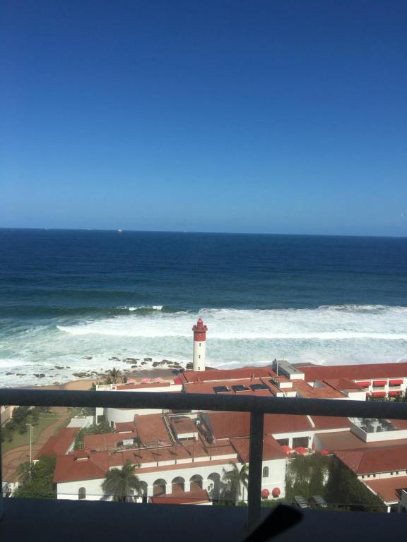 a view of the ocean and a lighthouse at Unit 1101 Oyster Rock in Durban