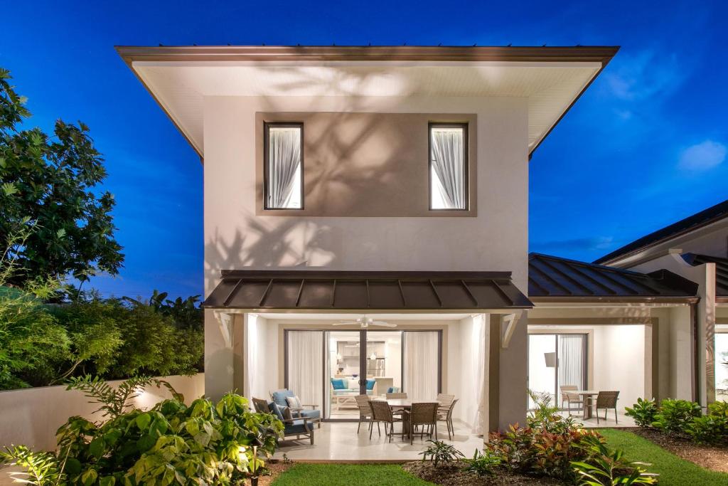 a home with a roof over a patio at Beach View Hotel in Saint James
