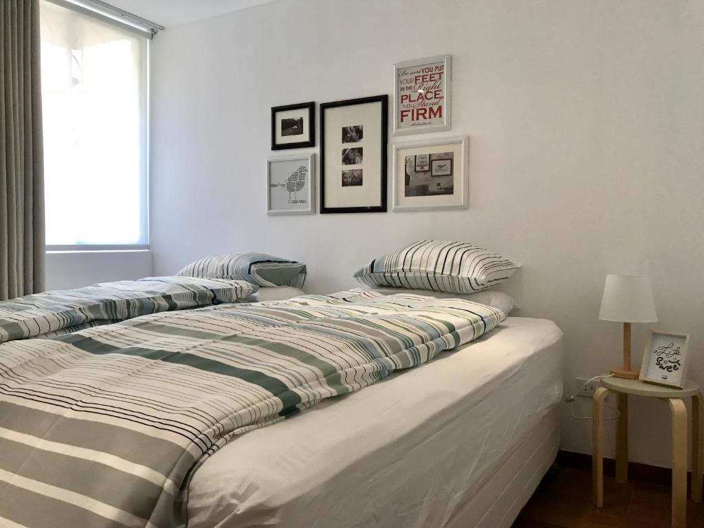 Postel nebo postele na pokoji v ubytování InkaHuset Pacasmayo