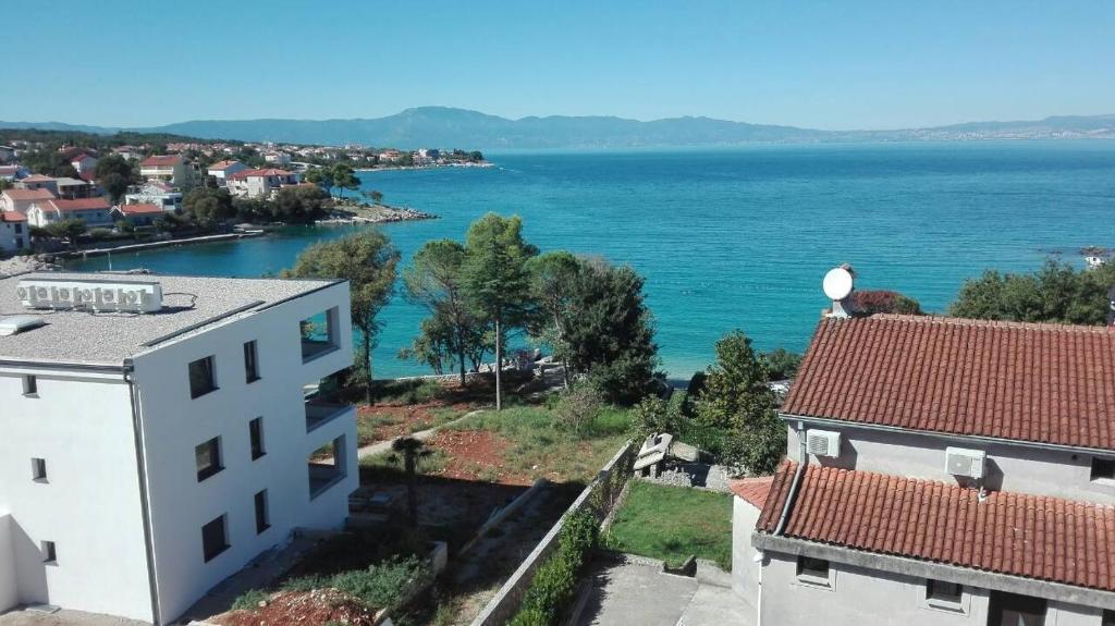 a view of the ocean from a building at Apartments Katić in Vantačići