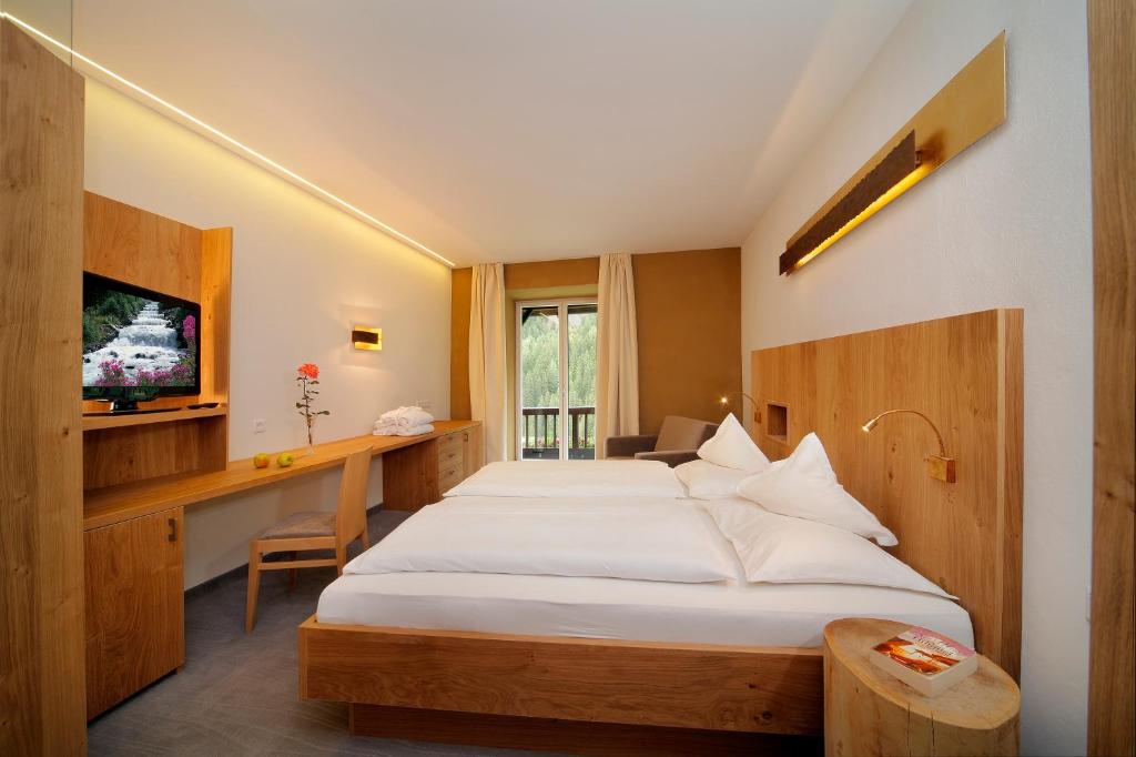 Posteľ alebo postele v izbe v ubytovaní Hotel Madatsch