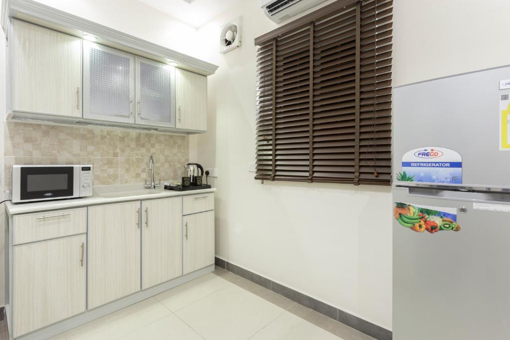 Kuchyň nebo kuchyňský kout v ubytování Dior Inn Apartment Hotel