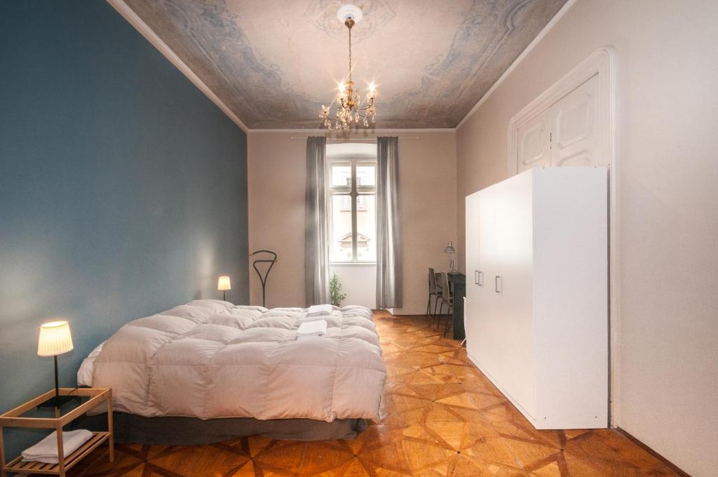 a bedroom with a large bed and a ceiling at Agli incanti in Trieste
