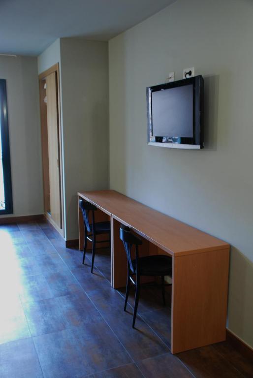 TV a/nebo společenská místnost v ubytování Hotel Pinxo