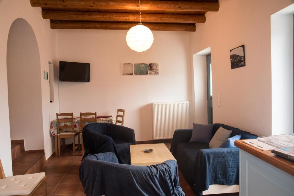 a living room with a couch and a table at Petra Traditional House in Episkopión