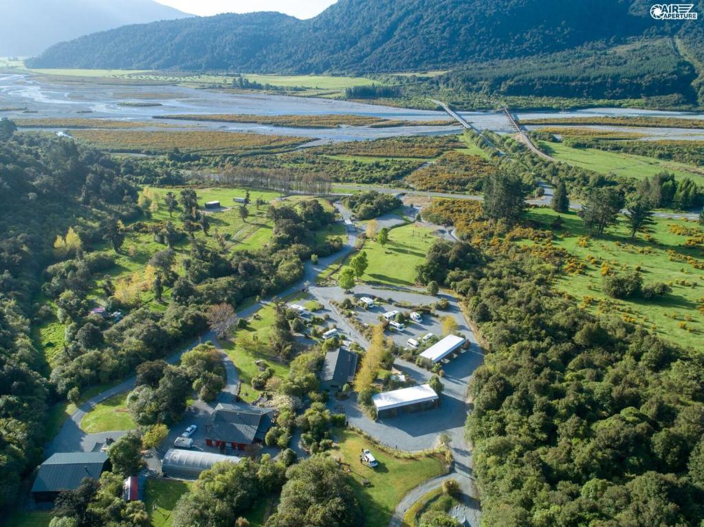 an aerial view of a river and a farm at Jackson's Retreat Alpine Holiday Park in Jacksons