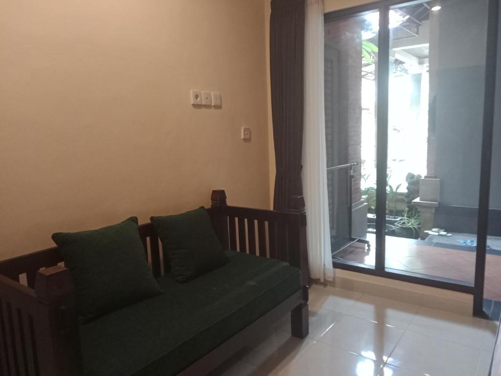 Posezení v ubytování Ubud Taksu Homestay