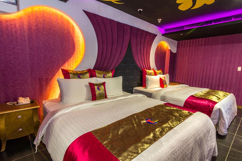 Postel nebo postele na pokoji v ubytování Ting-Shuai Motel