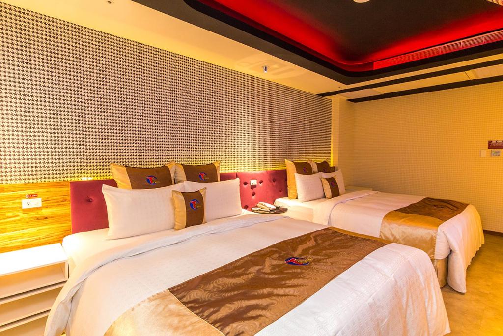 Postel nebo postele na pokoji v ubytování Ting-Shuai Motel