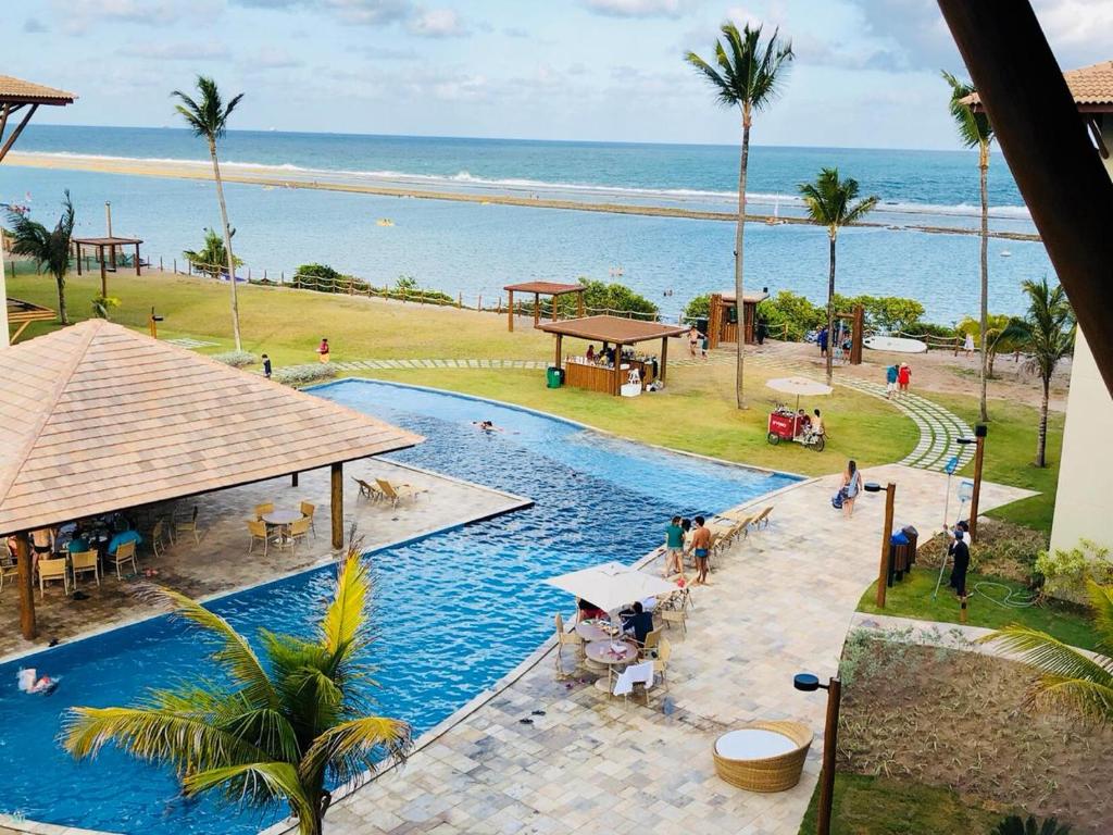 vista sull'alto di una piscina vicino all'oceano di Polinésia Flat Muro Alto Porto de Galinhas a Porto De Galinhas