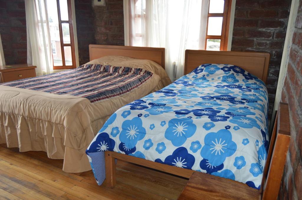Postel nebo postele na pokoji v ubytování Runa Wasi Quilotoa