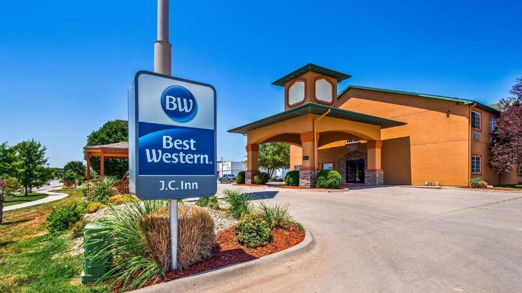 a best western sign in front of a building at Best Western J. C. Inn in Junction City