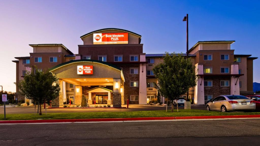 a hotel with a car parked in front of it at Best Western Plus Layton Park Hotel in Layton