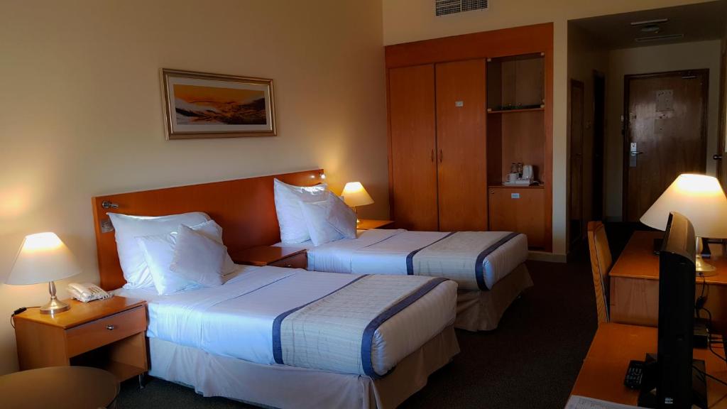 Postel nebo postele na pokoji v ubytování Lavender Hotel Deira