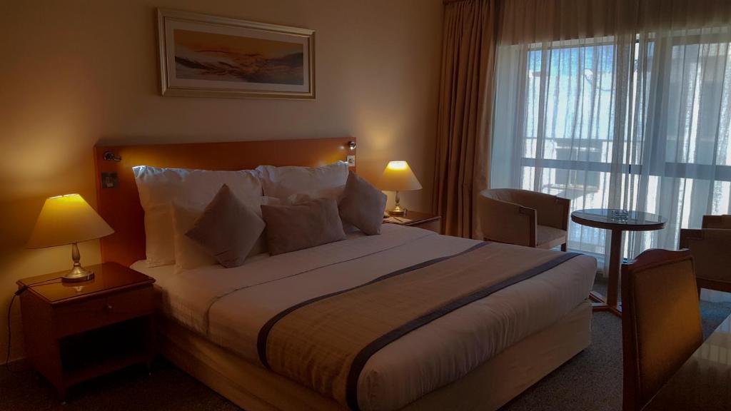Postel nebo postele na pokoji v ubytování Lavender Hotel Deira