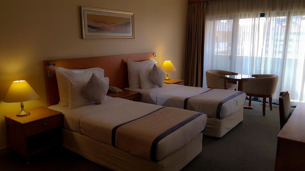 Postel nebo postele na pokoji v ubytování Lavender Hotel Deira