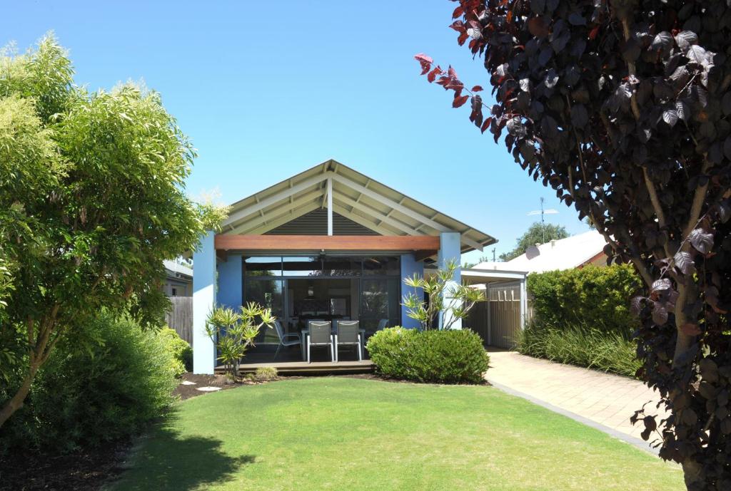 a house with a porch and a lawn at Beechtree in Dunsborough